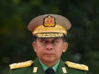 TOPSHOT - Myanmar's Chief Senior General Min Aung Hlaing, commander-in-chief of the Myanmar armed forces, arrives to pay his respects to Myanmar independence hero General Aung San and eight others assassinated in 1947, during a ceremony to mark the 71th anniversary of Martyrs' Day in Yangon on July 19, 2018. …