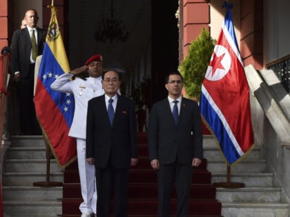 North Korea's President of the Presidium of the Supreme People's Assembly, Kim Yong Nam (2-R), poses with Venezuela's Foreign Minister Jorge Arreaza (R) at the Miraflores presidential palace, ahead of a private meeting with President Nicolas Maduro in Caracas, Venezuela on November 27, 2018. - Kim Yong Nam's visit is …