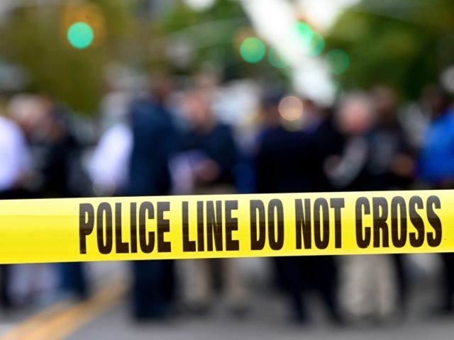 Police tape secures a crime scene outside a club after a shooting in Brooklyn on October 1