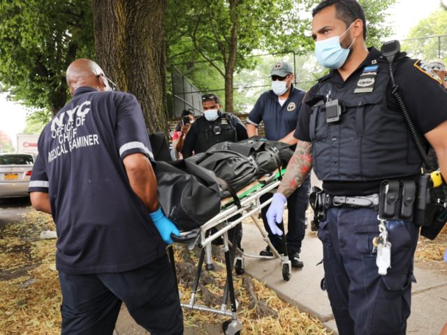 NEW YORK, NEW YORK - JULY 07: Police remove the body of a shooting victim on July 07, 2020 in the Brooklyn borough of New York City. New York City has witnessed a surge in gun violence over the past month with 9 people killed, including children, and 41 others …