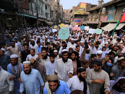 Supporters of a religious group Aalmi Majlis Tahaffuz Khatm-e-Nubuwwat, march during a rally in support of Khalid Khan, who killed a man allegedly accused of blasphemy, in Peshawar on July 31, 2020. - A Pakistani man facing charges of blasphemy was shot dead in court on July 29 as he …