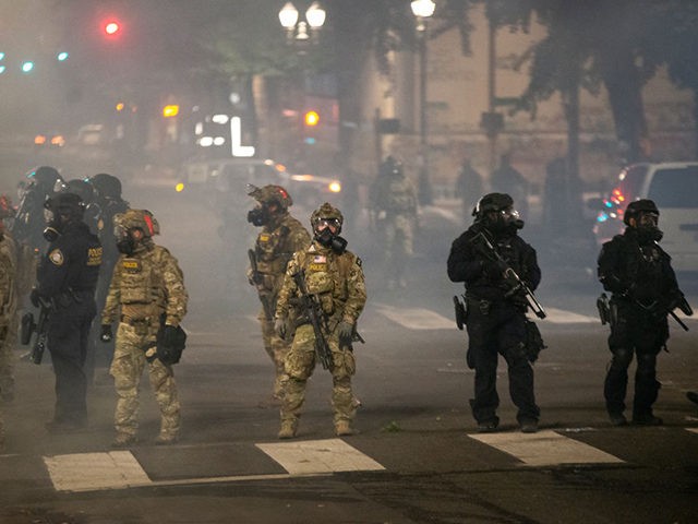 PORTLAND, OR - JULY 21: Federal police stand guard on Salmon Street after pushing proteste