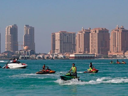 Youth ride jet-skis at Katara beach in the Qatari capital Doha on July 1, 2020 as the country moves into the second phase of its four-step plan to lift COVID-19 lockdown. - People in Qatar cautiously returned to beaches as the Gulf nation, which has one of the world's highest …