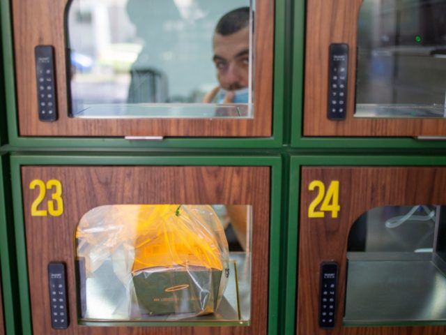 A ready to take away Go Noodles box is placed in a glass-paned locker in Tel Aviv, Israel,