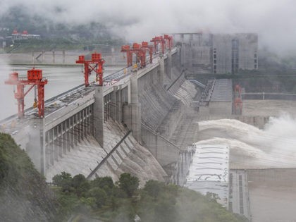 This picture taken on June 29, 2020 shows water being released from the Three Gorges Dam, a gigantic hydropower project on the Yangtze river, in Yichang, central China's Hubei province. - The Three Gorges Dam released water for the first time this year, as a preparation of the upcoming annual …