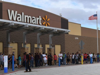 People wait in line for a Walmart store to open after Hurricane Harvey caused heavy flooding in Houston, Texas on August 30, 2017. Monster storm Harvey made landfall again Wednesday in Louisiana, evoking painful memories of Hurricane Katrina's deadly strike 12 years ago, as time was running out in Texas …