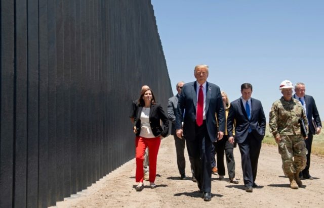 US President Donald Trump participates in a ceremony commemorating the 200th mile of new border wall on the US frontier with Mexico in San Luis, Arizona on June 23 © AFP/File SAUL LOEB