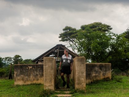 Former president of the Commercial Farmers Union (CFU) Deon Theron inspects a disused catt