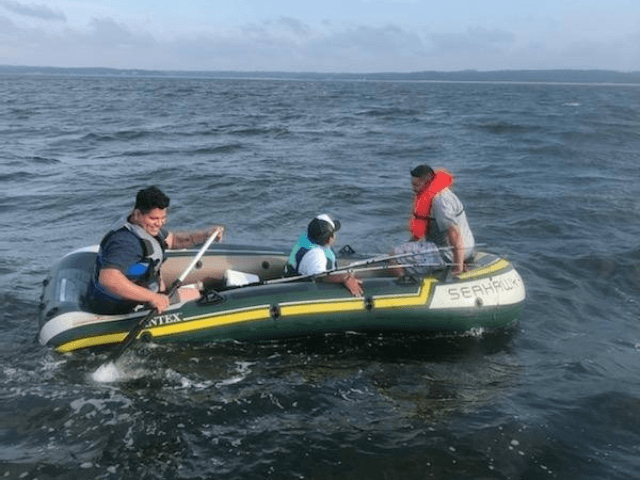 Three men in a blow-up boat stranded in the Long Island Sound in New York were rescued by