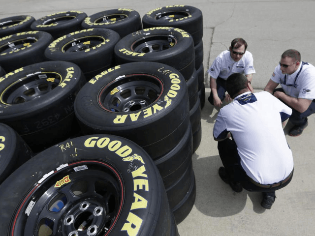 In this April 3, 2014 file photo, Goodyear tire technical officials discuss tires at the T