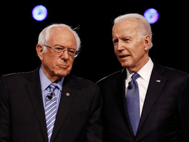 In this Feb. 25, 2020 file photo, Democratic presidential candidates, Sen. Bernie Sanders, I-Vt., left, and former Vice President Joe Biden, talk before a Democratic presidential primary debate in Charleston, S.C. Political task forces Biden formed with Sanders to solidify support among the Democratic Party's progressive wing recommended Wednesday, July …