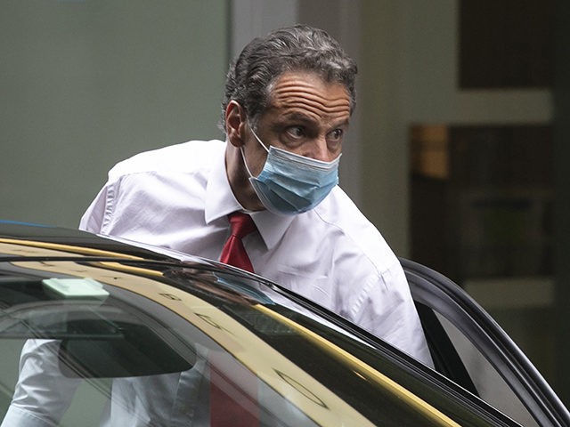 New York Gov. Andrew Cuomo steps from his car as he arrives at NewYork Stock Exchange to r