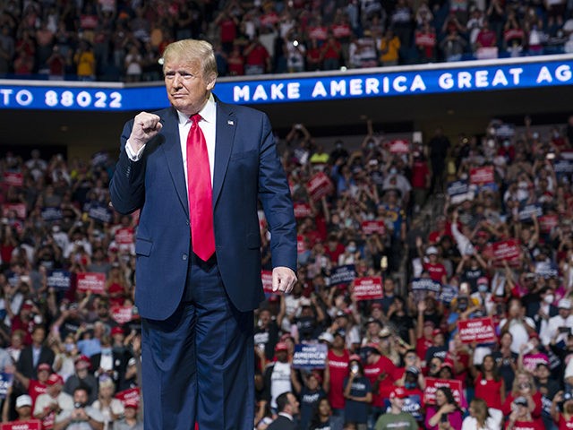 President Donald Trump arrives on stage to speak at a campaign rally at the BOK Center, Saturday, June 20, 2020, in Tulsa, Okla. Trump is asking Americans to let him keep his job. His critics are asking how much of that job he’s actually doing. Those questions have gotten louder …