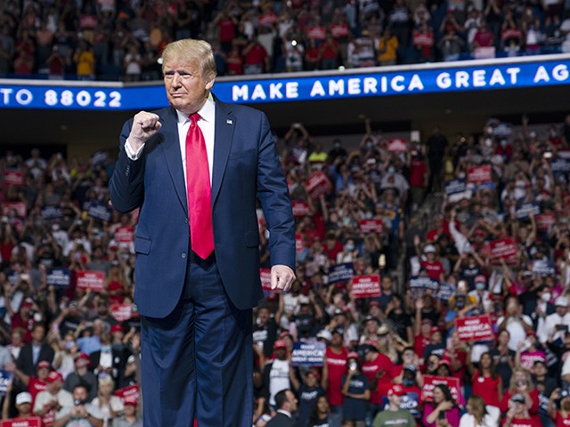 President Donald Trump arrives on stage to speak at a campaign rally at the BOK Center, Saturday, June 20, 2020, in Tulsa, Okla. Trump is asking Americans to let him keep his job. His critics are asking how much of that job he’s actually doing. Those questions have gotten louder in recent days following revelations that Trump didn’t read at least two written intelligence briefings detailing concerns that Russia was paying bounties to the Taliban for the deaths of Americans in Afghanistan. (AP Photo/Evan Vucci)