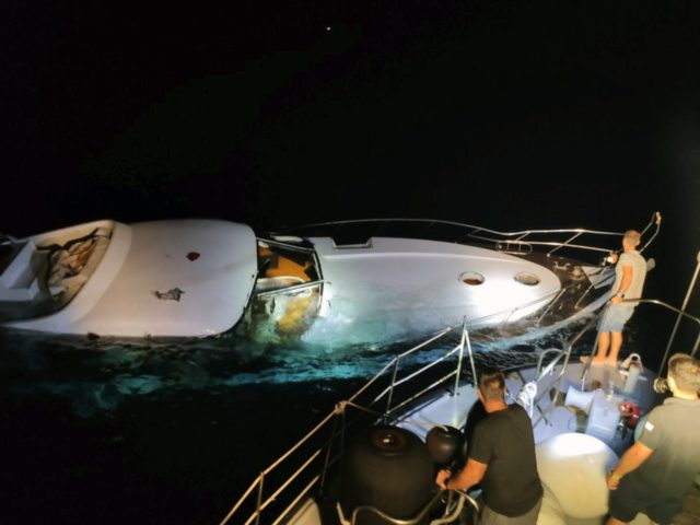 In this photo provided on Wednesday, Aug. 26, 2020 by the Greek Coast Guard, a half-sunken