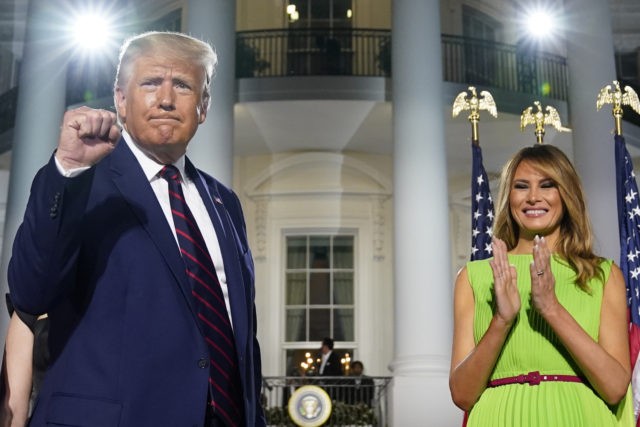 President Donald Trump and first lady Melania Trump stand on the South Lawn of the White House on the fourth day of the Republican National Convention, Thursday, Aug. 27, 2020, in Washington. (AP Photo/Evan Vucci)