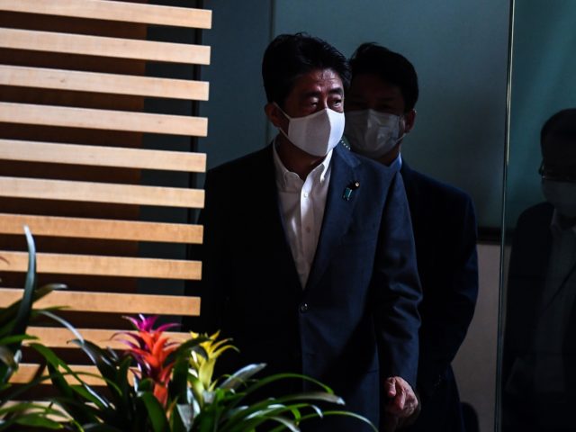 Japan's Prime Minister Shinzo Abe arrives at the Prime Minister's office in Tokyo on Augus