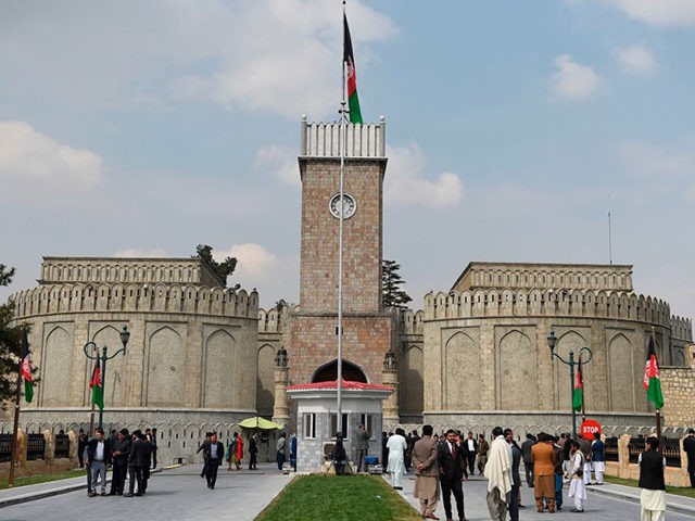 Officials gather at an entrance ahead of the start of Afghanistan President Ashraf Ghani's