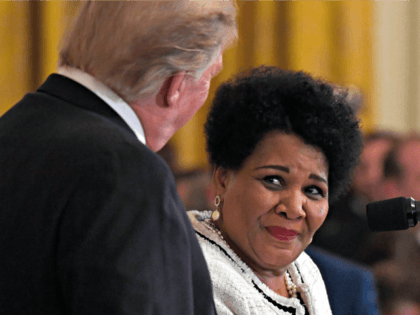 FILE - In this April 1, 2019, file photo President Donald Trump, left, listens as former prisoner Alice Marie Johnson, right, speaks at the 2019 Prison Reform Summit and First Step Act Celebration in the East Room of the White House in Washington. The 64-year-old African American great-grandmother spent 21 …