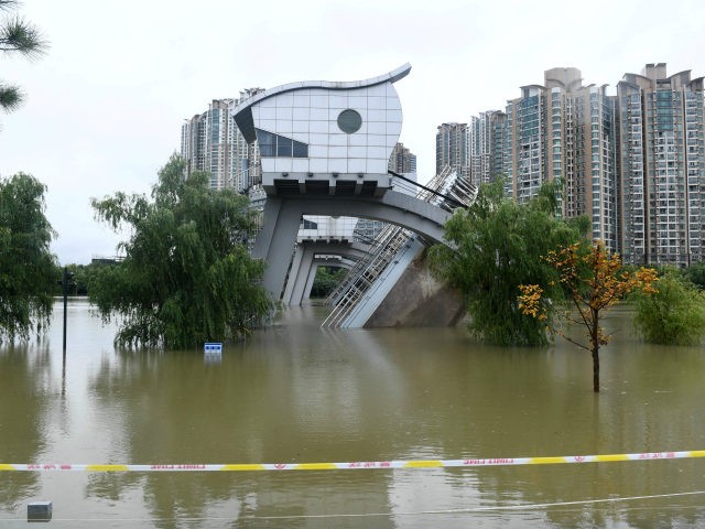 Flooded buildings are seen in Nanjing, in China's eastern Jiangsu province on July 19, 2020. - Vast swathes of China have been inundated by the worst flooding in decades along the mighty Yangtze River, with residents piling into boats and makeshift rafts to escape a deluge that has collapsed flood …