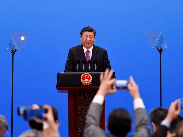 China's President Xi Jinping speaks at a press conference at the end of the final day of the Belt and Road Forum at the China National Convention Centere at the Yanqi Lake venue outside Beijing on April 27, 2019. (Photo by WANG ZHAO / POOL / AFP) (Photo credit should …