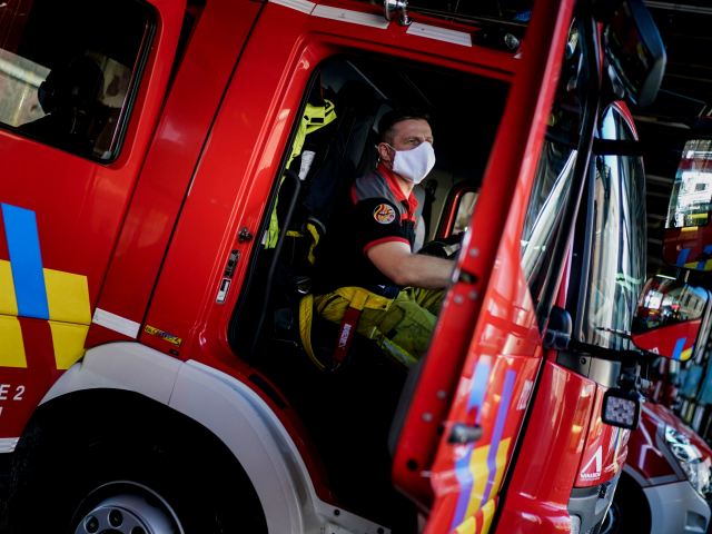 Belgian firemen prepare their vehicles at the Central Fire Station in Liege on April 10, 2