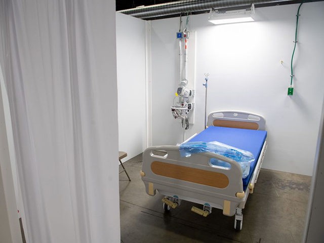A patient room is seen at a temporary field hospital featuring 437 beds for patients suffering from coronavirus, COVID-19, and part of the city's medical surge response plan as an alternate care site to assist hospitals at the Walter E. Convention Center in Washington, DC, May 11, 2020. (Photo by …