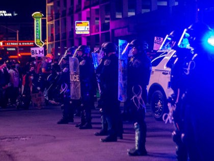 Police officers stand guard, on June 1, 2020, in downtown Las Vegas, during a "Black lives