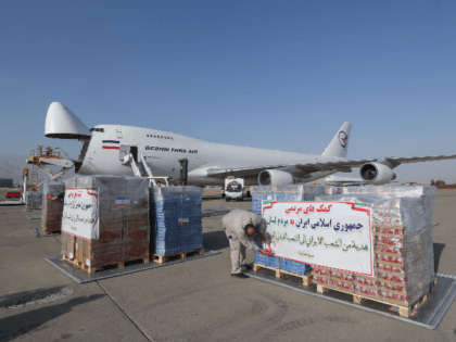 Iranian Red Crescent workers load a plane with aid to the Lebanese people on the tarmac of Mehrabad airport in the capital Tehran, on August 5, 2020. - The death toll from a huge blast at Lebanon's Beirut port has risen to at least 113, as at least 4,000 people …