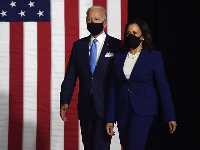 Democratic presidential nominee and former US Vice President Joe Biden (L) and vice presidential running mate, US Senator Kamala Harris, arrive to conduct their first press conference together in Wilmington, Delaware, on August 12, 2020. (Photo by Olivier DOULIERY / AFP) (Photo by OLIVIER DOULIERY/AFP via Getty Images)