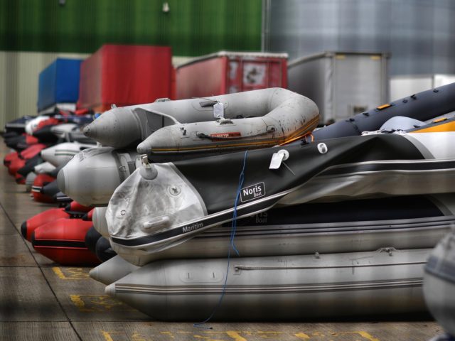 Dinghies are seen stored in a Port Authority yard, believed to have been used by migrants picked up at sea whilst crossing the English Channel, in Dover, south-east England on August 15, 2020. (Photo by Ben STANSALL / AFP) (Photo by BEN STANSALL/AFP via Getty Images)