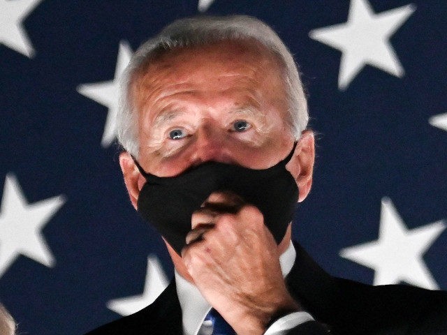 Jill Biden and husband former vice-president and Democratic presidential nominee Joe Biden wear facemasks as they watch fireworks outside the Chase Center in Wilmington, Delaware, at the conclusion of the Democratic National Convention, held virtually amid the novel coronavirus pandemic, on August 20, 2020. (Photo by Olivier DOULIERY / AFP) …