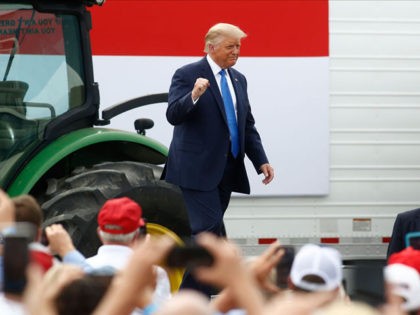 MILLS RIVER, NC - AUGUST 24: U.S. President Donald Trump takes a stage to speak at Flavor 1st Growers & Packers on August 24, 2020 in Mills River, North Carolina. Trump toured the facility to highlight the Farmers to Families Food Box program. Trump is in North Carolina for the …
