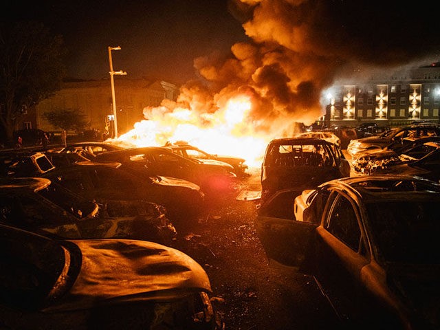KENOSHA, WI - AUGUST 24: Cars are set on fire in a used car lot on August 24, 2020 in Kenosha, Wisconsin. This is the second night of rioting after the shooting of Jacob Blake, 29, on August 23. Blake was shot multiple times in the back by Wisconsin police …