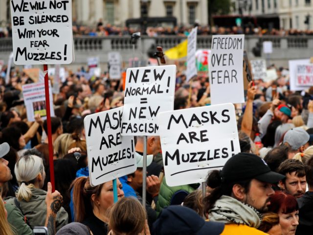 Protesters hold up placards as they gather in Trafalgar Square in central London to "expose the truth about Covid and lockdown" at a demonstration organised by Save our Rights on August 29, 2020. (Photo by Tolga AKMEN / AFP) (Photo by TOLGA AKMEN/AFP via Getty Images)