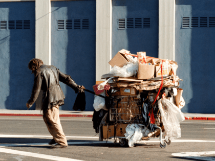 A man tows his cart down the street on Skid Row December 11, 2000 in Los Angeles, CA. (Photo by David McNew/Newsmakers)