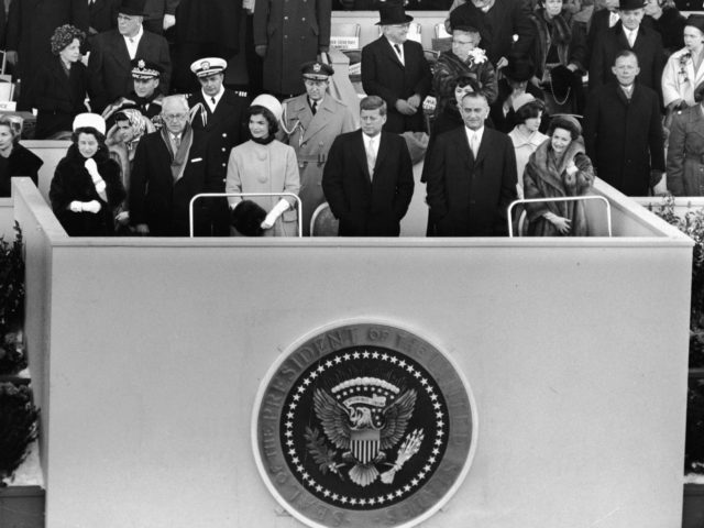 American President John Fitzgerald Kennedy (1917 - 1963) stands on a platform for his inau