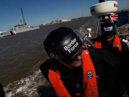 LONDON, ENGLAND - MARCH 16: Border Force officers go out on patrol on a RIB (Rigid Inflatable Boat) which will be operating from the new cutter HMC Protector (pictured behind), on March 16, 2014 in London, England. The cutter, officially launched by the Home Secretary Theresa May MP on 17th …