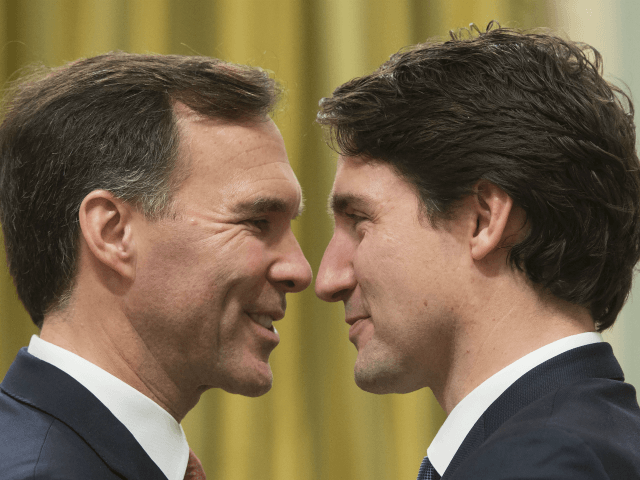 Canadian Prime Minister Justin Trudeau (R) speaks with Finance Minister Bill Morneau at Rideau Hall in Ottawa on November 4, 2015. Trudeau was sworn in as Canada's 23rd prime minister Wednesday before a packed, flag-waving crowd, almost 50 years after his father took on the job. AFP PHOTO/POOL/SEAN KILPATRICK / …