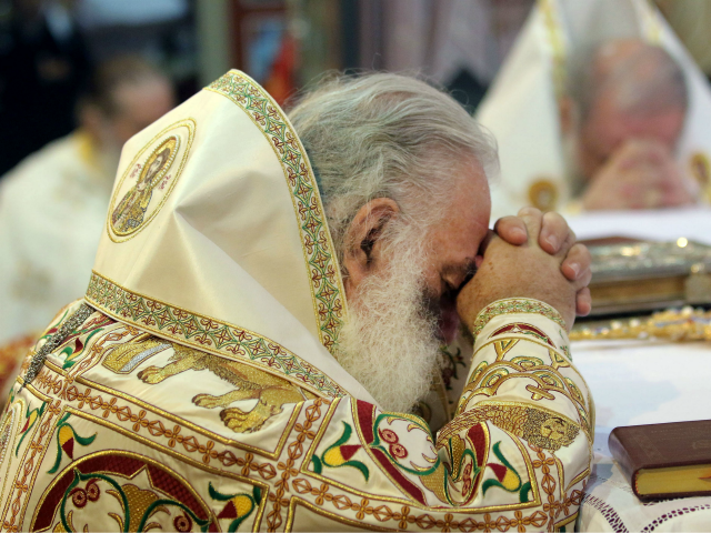 Religious Orthodox Christians leaders pray inside a church in Heraklion on the Greek island of Crete on June 19, 2016. Orthodox churches from around the world meet in Greece on June 19, 2016 for the first such gathering in a millennium, but the absence of several branches of the communion …