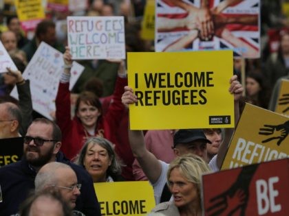 Thousands marched in central London calling on the British government to do more to help refugees fleeing conflict and persecution. / AFP / DANIEL LEAL-OLIVAS (Photo credit should read DANIEL LEAL-OLIVAS/AFP via Getty Images)