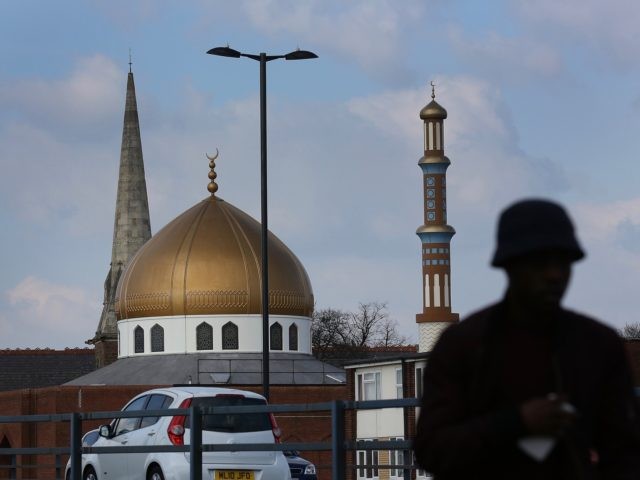 BIRMINGHAM, ENGLAND - MARCH 23: A mosque stands next to a church in Lozells on March 23, 2