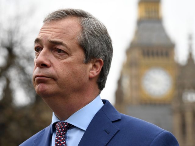 Nigel Farage, former Leader of the United Kingdom Independence Party (UKIP), reacts as he gives a television interview outside the Houses of Parliament in central London on March 29, 2017. - British Prime Minister Theresa May will formally launch Brexit today after signing the letter to begin the country's departure …