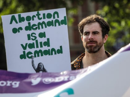 LONDON, ENGLAND - JUNE 05: Pro-choice campaigners hold placards outside the Houses of Parl