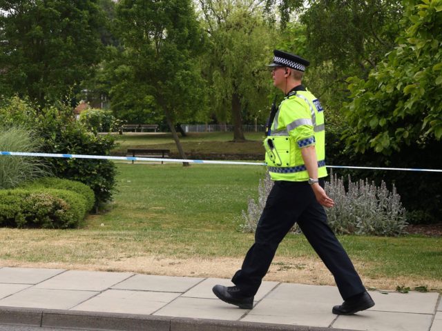 A police officer patrols at a cordon outside Queen Elizabeth Gardens in Salisbury, southern England, on July 4, 2018 believed to be cordoned off in relation to a major incident declared after two people were found unconcious at a residence in nearby Amesbury. - Two people have been hospitalised in …
