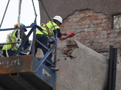 GLASGOW, SCOTLAND - JULY 10: Workers begin the demolition of the burnt-out Glasgow Art Sch