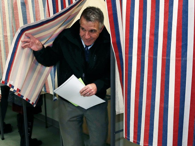 Republican Vermont Gov. Phil Scott smiles as he leaves the ballot booth after voting in Be