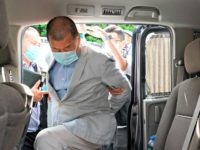 Hong Kong media tycoon Jimmy Lai, who founded local newspaper Apple Daily, gets into a car after being arrested by police officers at his home in Hong Kong, Monday, Aug. 10, 2020. Hong Kong police arrested Lai and raided the publisher's headquarters Monday in the highest-profile use yet of the …