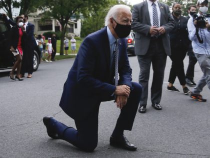 Joe Biden kneeling (Matt Slocum / Associated Press)