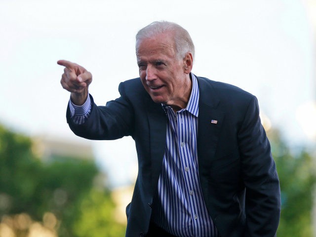 VIce President Joe Biden points to supporters during a campaign event with President Barac